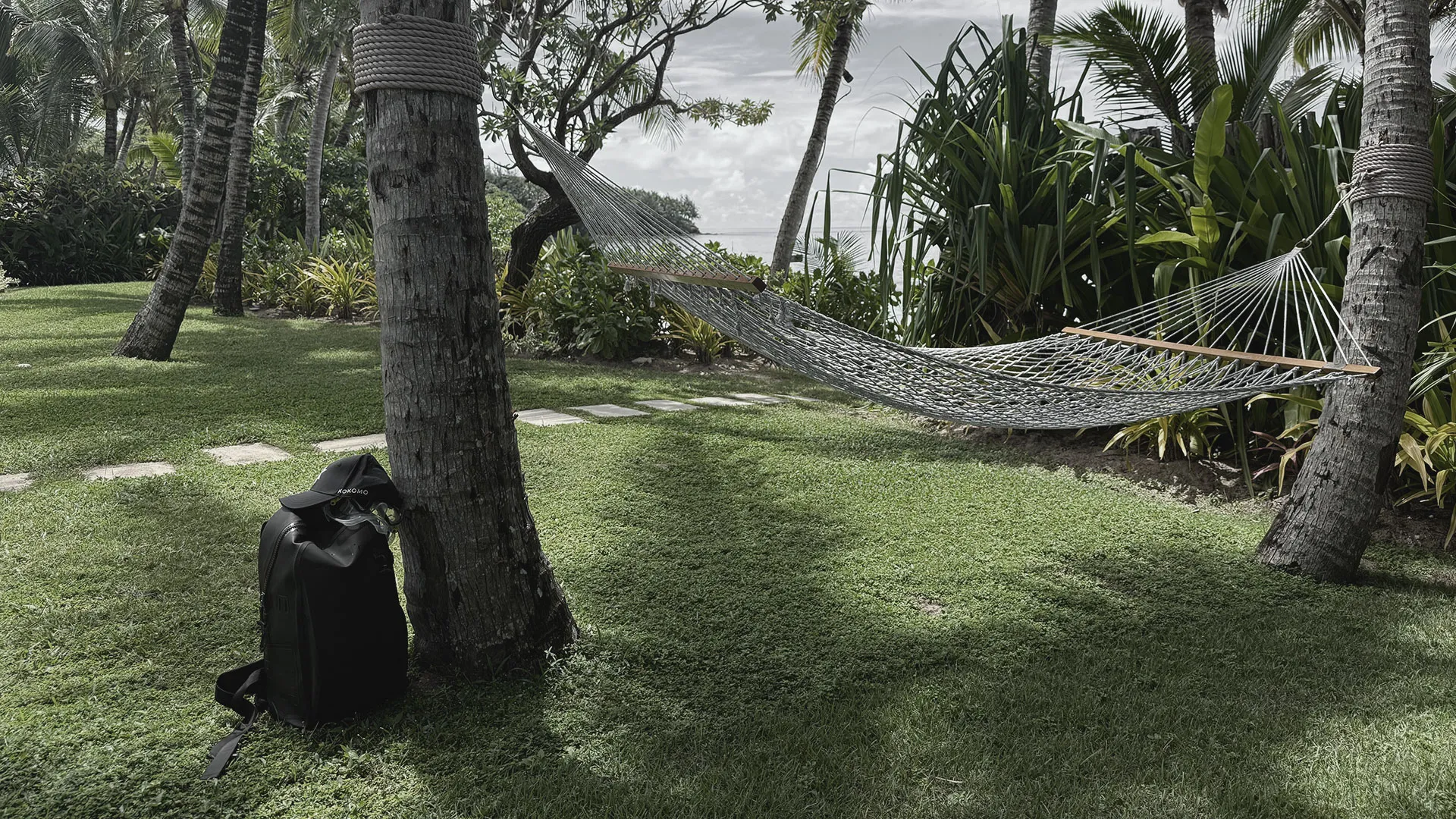The EP01 pack resting on the grass by the shore